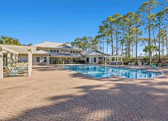 A large house with a pool in the backyard.