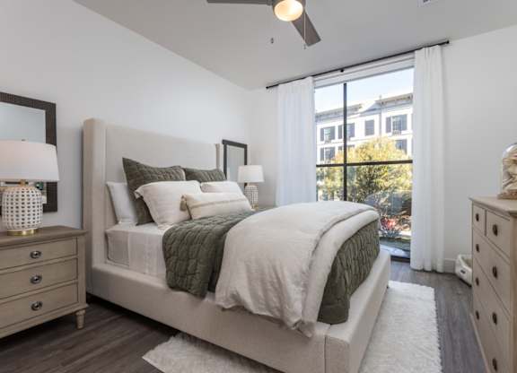 The primary bedroom with oversized windows at 2020 Providence in Huntsville, AL