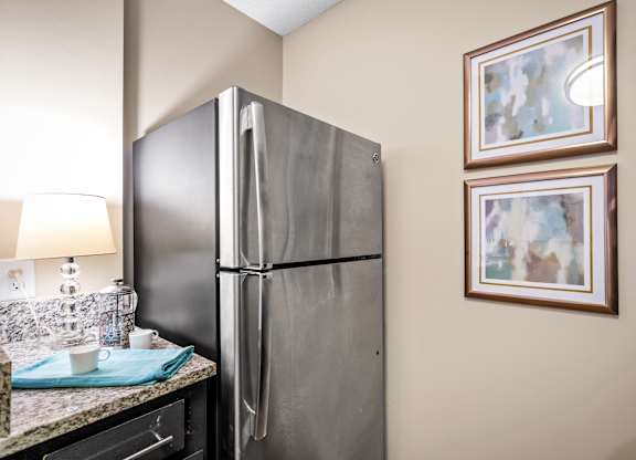 a kitchen with stainless steel appliances at 701 South Apartments in Mobile, AL