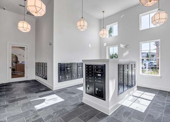 A modern kitchen with a black fridge and stove.