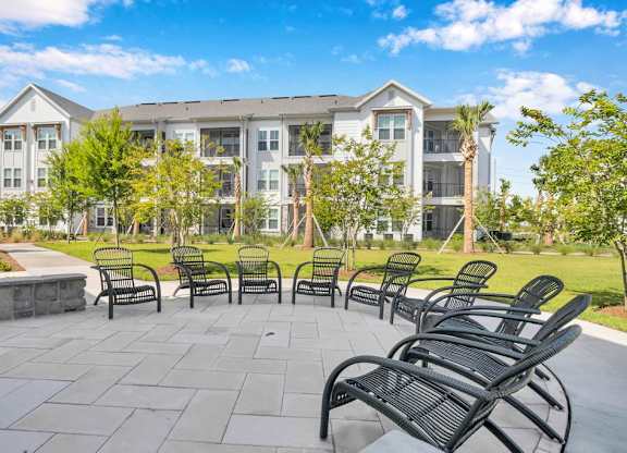 A large building with a patio in front of it.