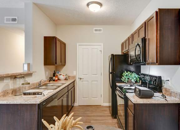 Black Appliances in Kitchen at Austin Place Apartments
