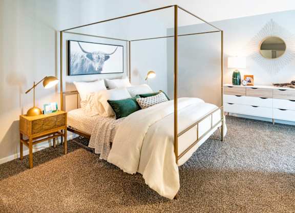 bedroom with natural light and plush carpet at Saddlebrook at Tates Creek Apartments in Lexington, KY