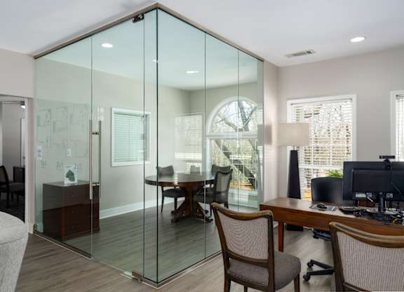 Leasing office with conference area, wood floors and seating in Summerchase at Riverchase in Hoover, Alabama