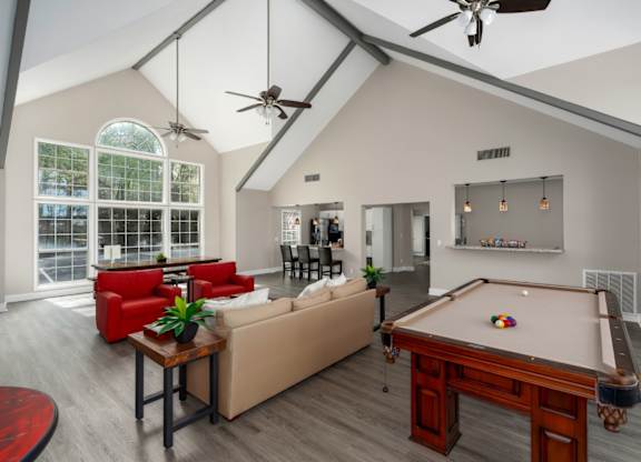 Clubhouse featuring seating and a pool table at Summerchase at Riverchase in Hoover, Alabama