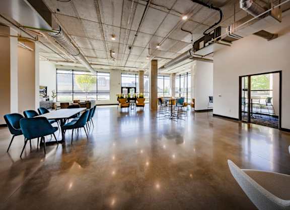 Clubhouse with a conference table and chairs at Wesley Place Apartments in Indianapolis, IN
