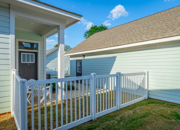 cottage with fenced patio at Anthem Apartments and Cottages in Huntsville, Alabama