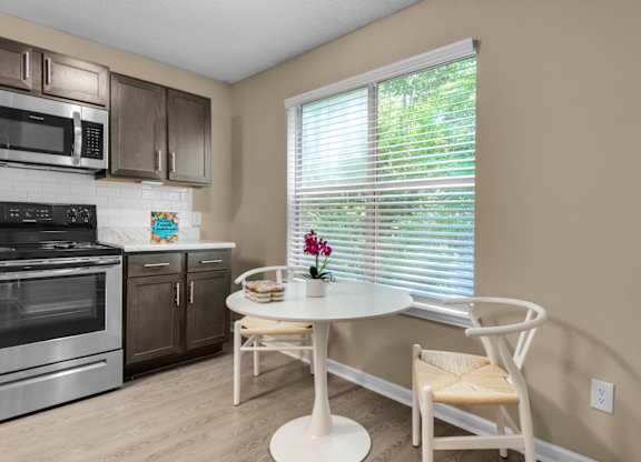 A dining table near the window in the kitchen at Crystal Lake in Pensacola, Florida.