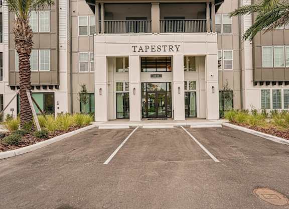 Main entrance to Tapestry University Park Apartments in Sarasota, FL