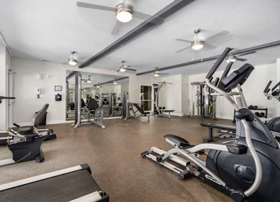 Fitness center with ceiling fans and exercise equipment at Summerchase at Riverchase in Hoover, Alabama