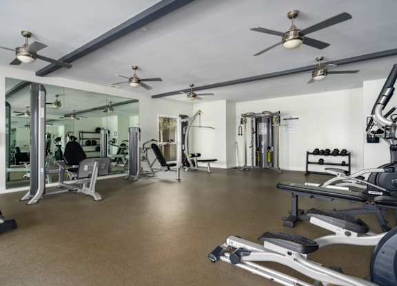 Fitness center with ceiling fans and exercise equipment at Summerchase at Riverchase in Hoover, Alabama