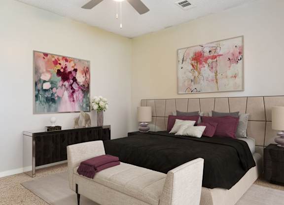 A bedroom with a large bed, a chair, and two paintings on the wall.