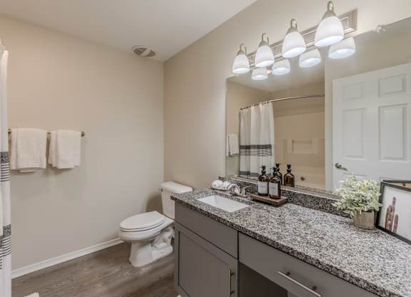 Bathroom with granite countertop and undermount sink at Grande View Apartments in Biloxi, MS