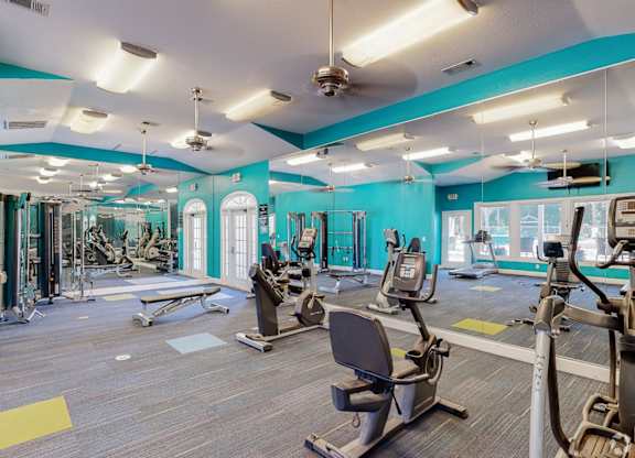 Fitness center with cardio and resistance equipment at Grande View Apartments in Biloxi, MS
