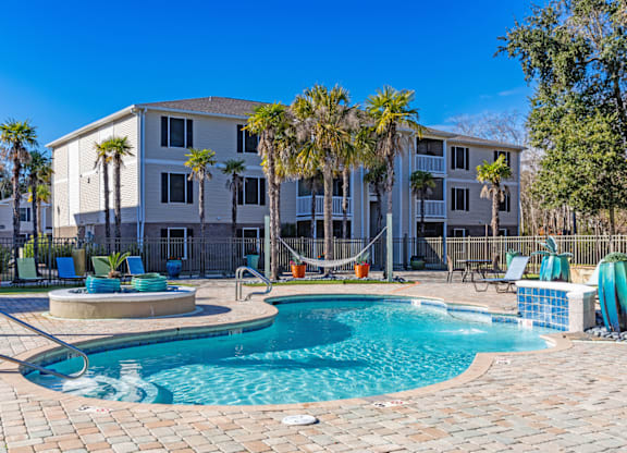 Resort-style swimming pool and sundeck at Grande View Apartments in Biloxi, MS