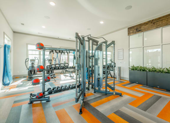 club quality fitness center with a cardio and strength training equipment at Anthem Apartments and Cottages in Huntsville, Alabama