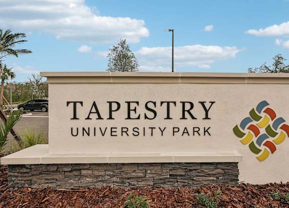 Monument sign at Tapestry University Park apartments in Sarasota, FL