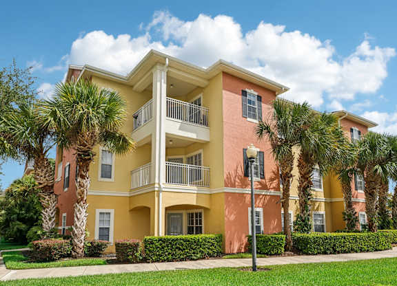 a building with palm trees in front of it