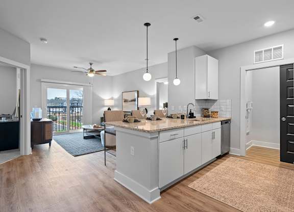 A kitchen with a countertop and cabinets is shown.