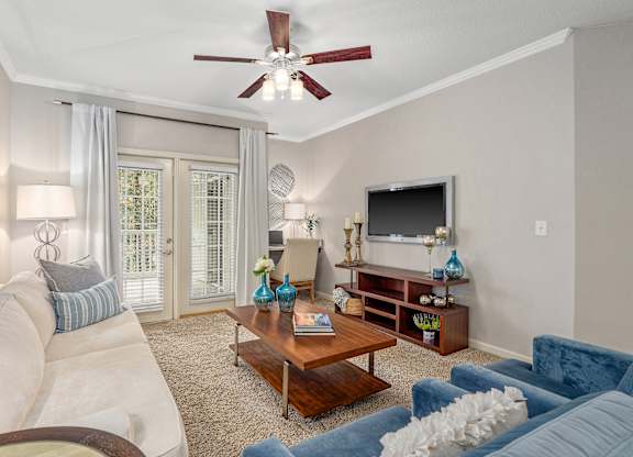 Spacious living room with a patio at Magnolia Preserve in Dothan, AL