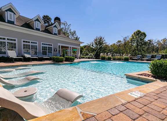 Resort-style pool and tanning ledge at Magnolia Preserve