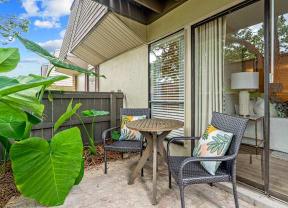 A patio with a table and chairs is shown.