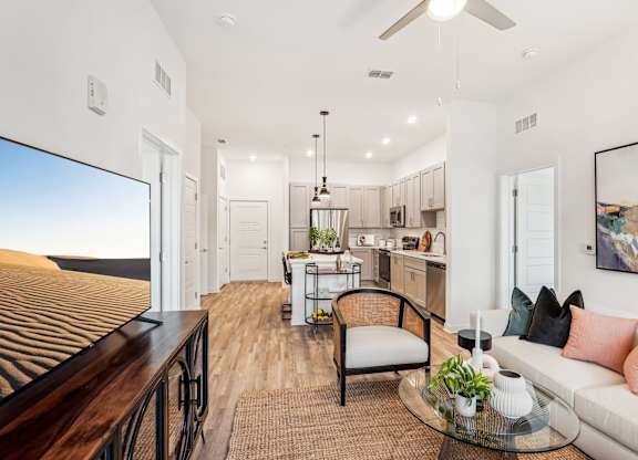 A modern living room with open floor plan at Tapestry University Park apartments in Sarasota, FL