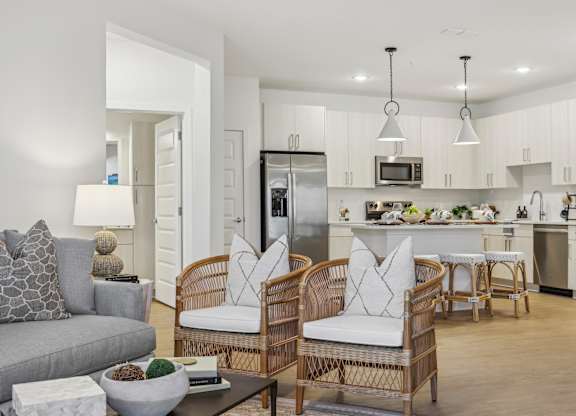 A modern kitchen with a dining table and chairs.