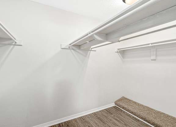 Large walk-in closet with built in shelving and rods at Oakley at hillcrest in west mobile, al