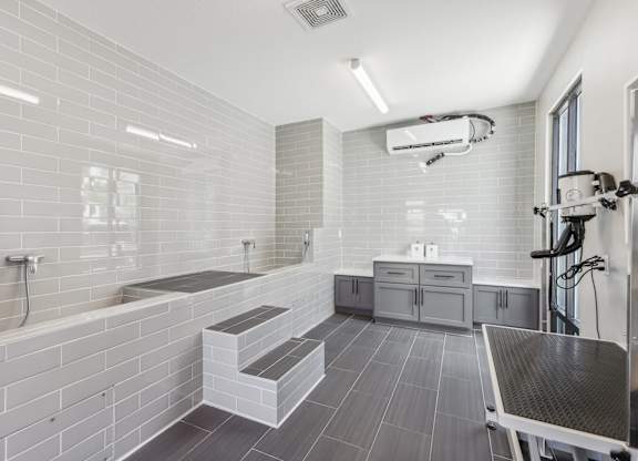 a white bathroom with a shower and a sink and a tub