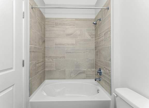 Tub shower combo with tile surround at Southern at Santa Rosa