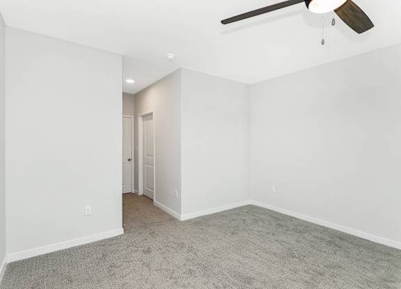 Spacious guest bedroom in the Coral Key floor plan at Southern at Santa Rosa