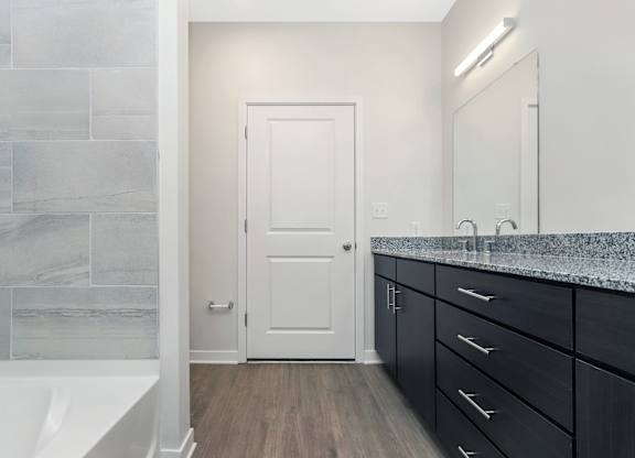 Primary bathroom with tub shower combo at Southern Santa Rosa