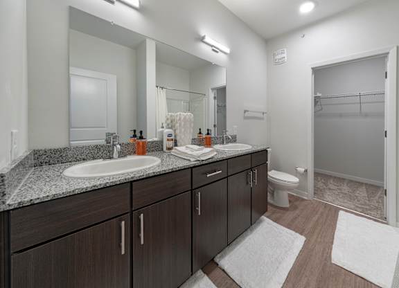 Primary bathroom with double vanity in the Coastal model floor plan