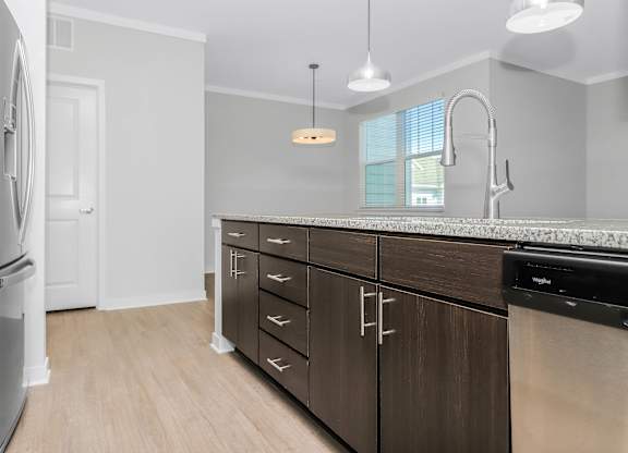 Kitchen island with lots of storage and a dishwasher Southern at Santa Rosa