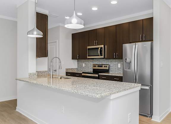 Modern kitchen with large island Seabreeze floor plan at Southern Santa Rosa