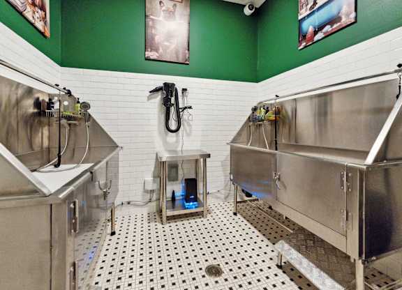 a brewery with three stainless steel fermentation tanks