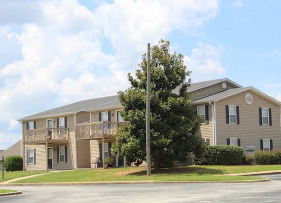 A large apartment building at The Avery at Auburn Apartments in Auburn, AL