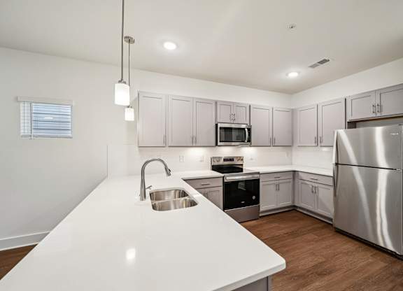 Modern kitchen with shaker cabinets at Turnberry Park in Gardendale, AL