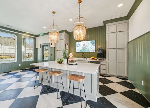 Clubhouse kitchen with island and coffee station at Turnberry Park in Gardendale, AL