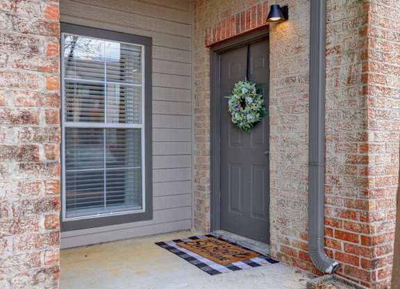 A grey door with a wreath on it at Village at Caldwell Mill in Birmingham, AL