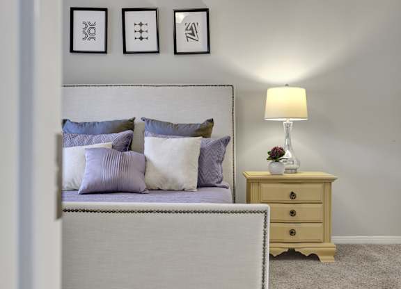 Bedroom with plush carpet Village at Caldwell Mill Apartments in Birmingham, AL