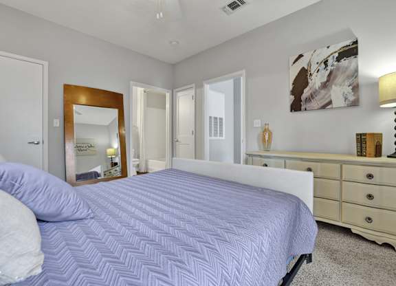 Bedroom with en-suite bathroom at Village at Caldwell Mill Apartments in Birmingham, AL