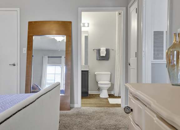 Bedroom with en-suite bathroom at Village at Caldwell Mill Apartments in Birmingham, AL