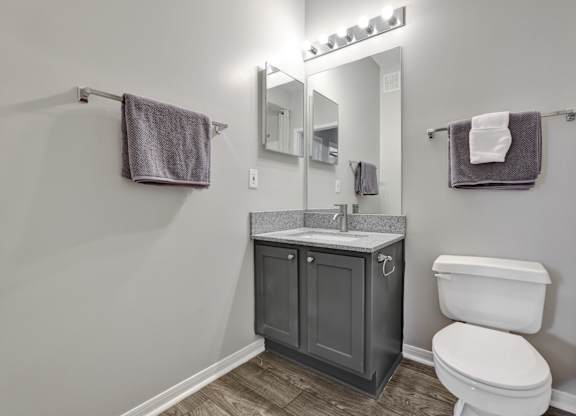 A bathroom with a towel rack at Village at Caldwell Apartments in Birmingham, AL