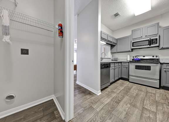 laundry room off of the kitchen at Village at Caldwell Apartments in Birmingham, AL