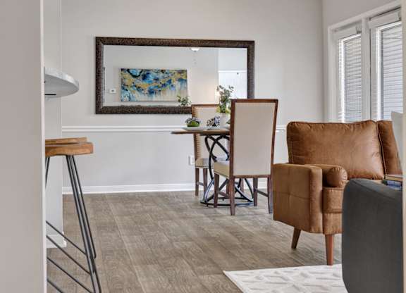 a living room and dining room at Village at Caldwell Mill apartments in Birmingham, AL