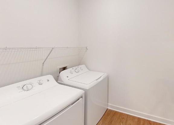 full size washer/dryer in a laundry room at Wesley Place Apartments in Indianapolis, Indiana