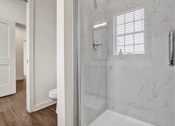 En-suite bathroom with stand-alone shower at West Row Townhomes and at West Row Townhomes at West Row Lofts and Townhomes in Birmingham, AL
