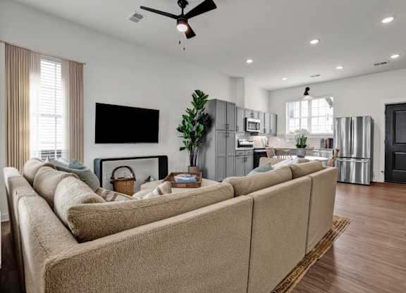 Open floor plan with wood-style flooring at West Row Townhomes and at West Row Townhomes at West Row Lofts and Townhomes in Birmingham, AL